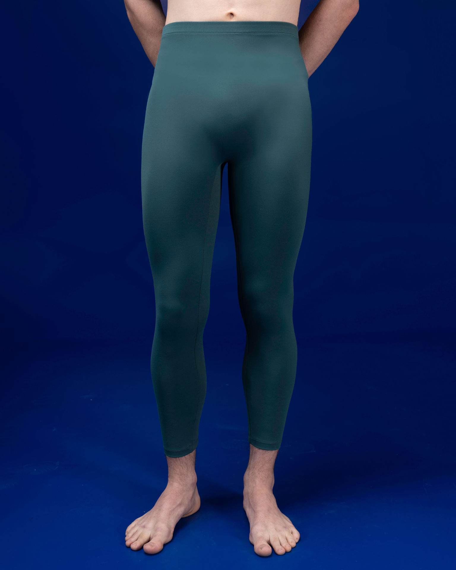 Male dancer wearing male dancewear forest green tights