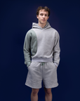 Male dancer wearing male dancewear grey warm up shorts