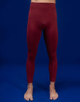 Male dancer wearing male dancewear deep red tights