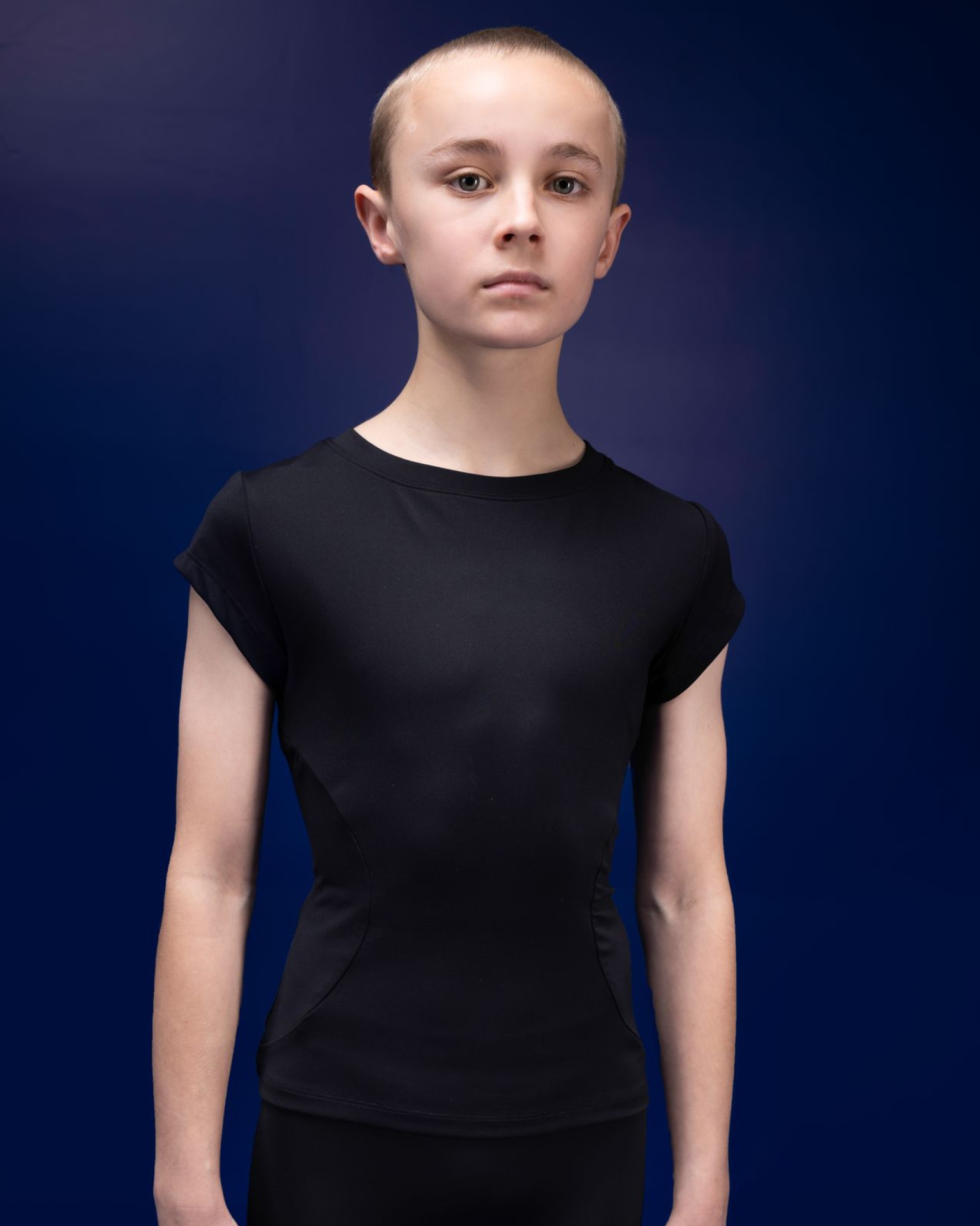 Male dancer wearing male dancewear black tee