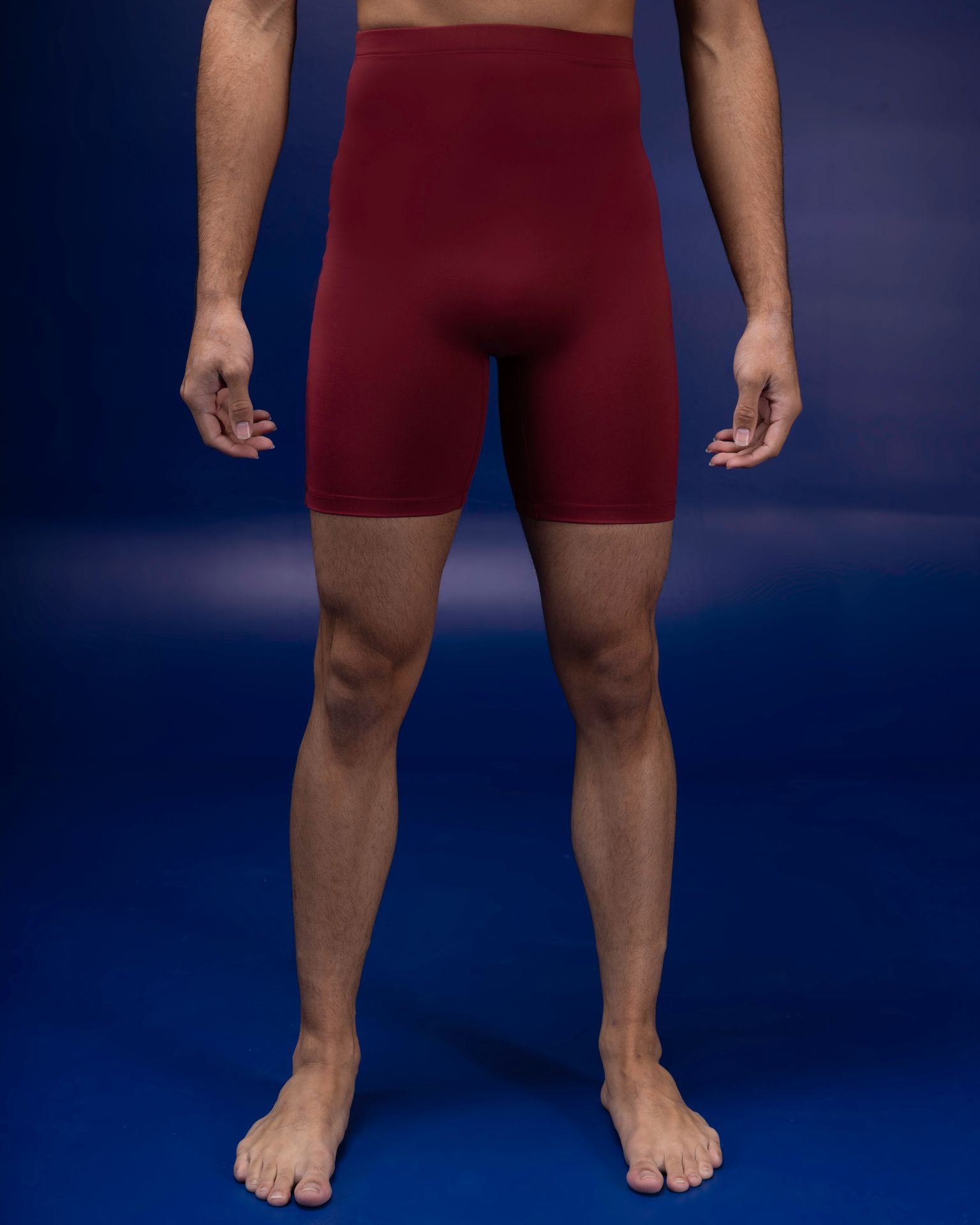 Male dancer wearing male dancewear deep red bike shorts