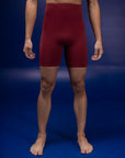 Male dancer wearing male dancewear deep red bike shorts