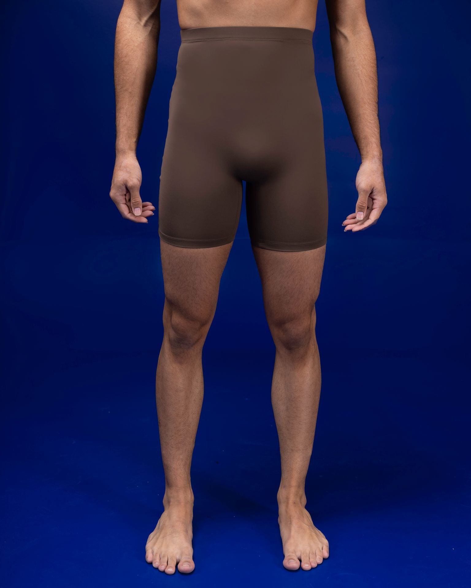 Male dancer wearing male dancewear brown chocolate bike shorts