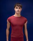 Male dancer wearing male dancewear red tee